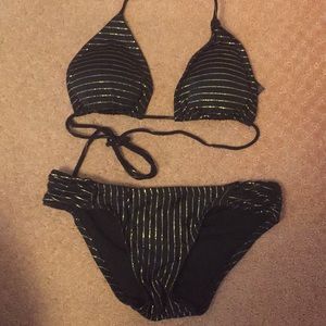 Trunkettes black and gold metallic string bikini